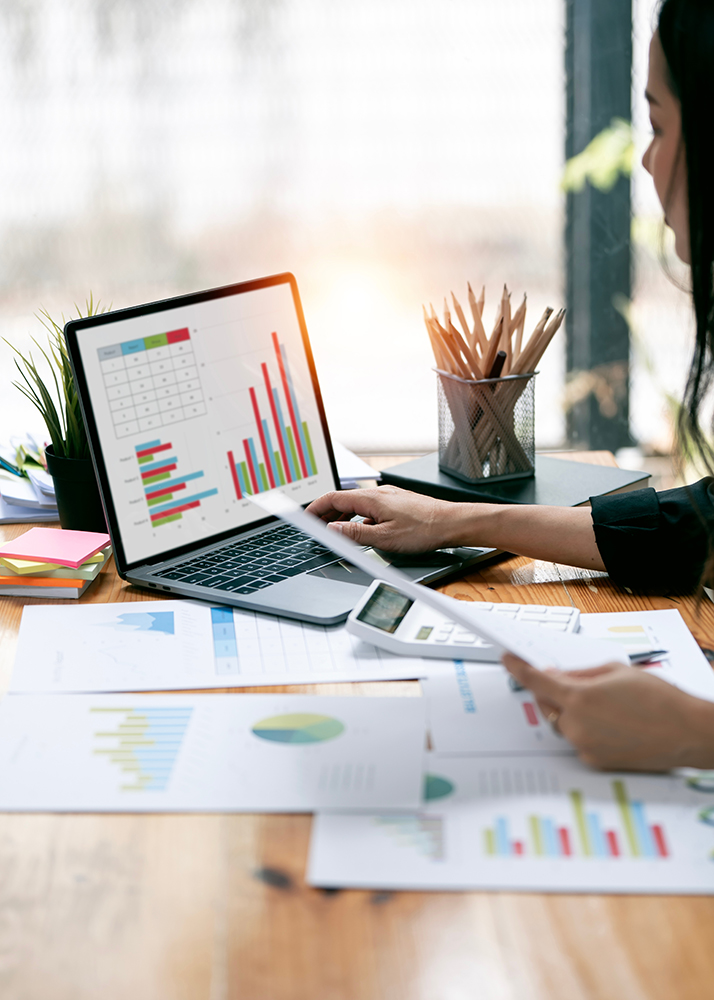 Businesswoman working at office with document on her desk, doing planning analyzing the financial report, business plan investment, finance analysis concept